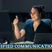 the image of a women with a laptop and imac conducting an online meeting and taking calls, with headsets on. The image is labelled as unified communications and she is satisfied with the services.